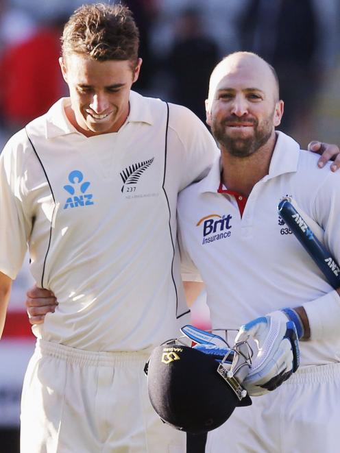 England's Matt Prior and New Zealand's Tim Southee leave the field together after Prior saved the...