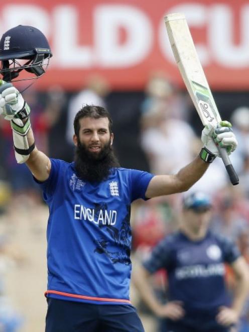 England's Moeen Ali celebrates reaching his century against Scotland in Christchurch. REUTERS...
