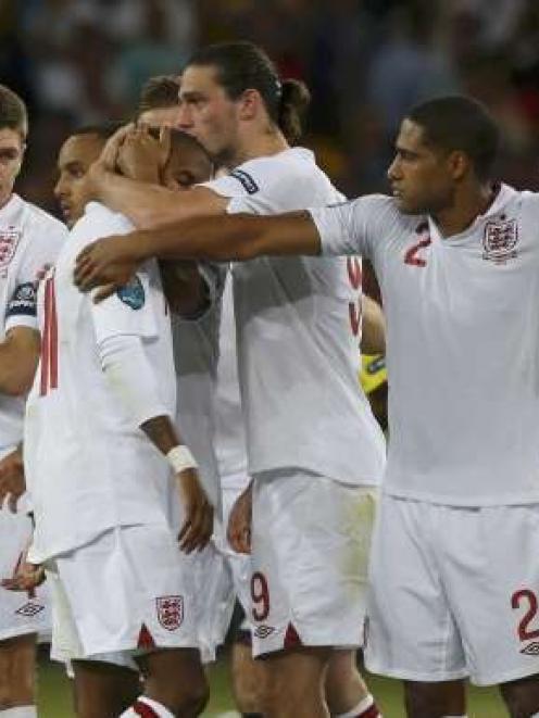 England's players react during the penalty shoot-out.   REUTERS/Eddie Keogh