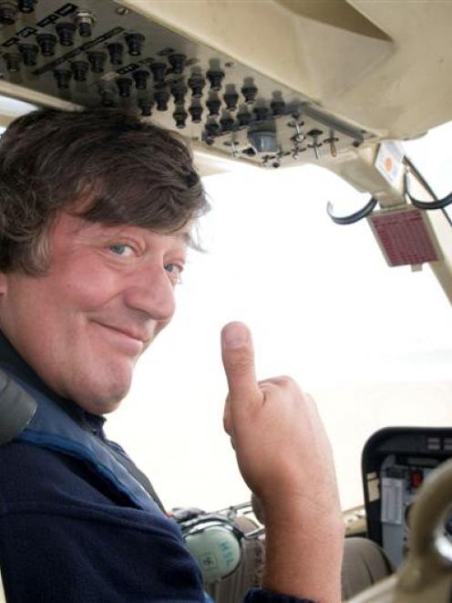 English wit Stephen Fry on his way to Codfish Island on Monday to film a BBC documentary series...