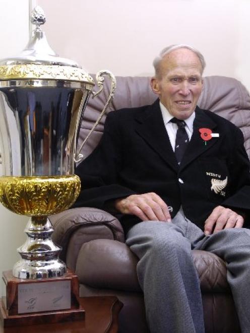 Enjoying a close look at the Gallaher Cup at Birchleigh Rest Home in Mosgiel yesterday is Otago's...