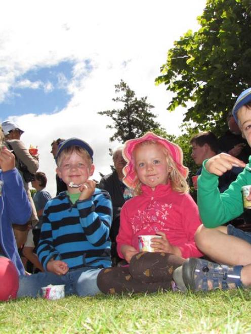 Enjoying eating strawberries and cream at the Waimate Strawberry Fare on Saturday are the Hay...
