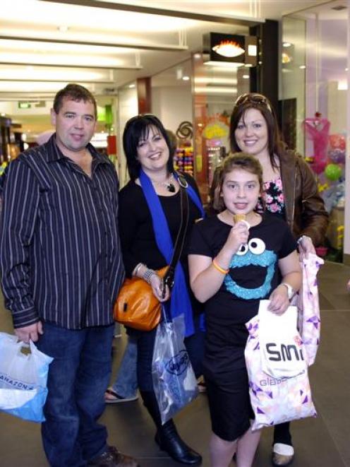 Enjoying some retail therapy in George St, Dunedin, yesterday are (above) Dwayne and Katie Smith,...