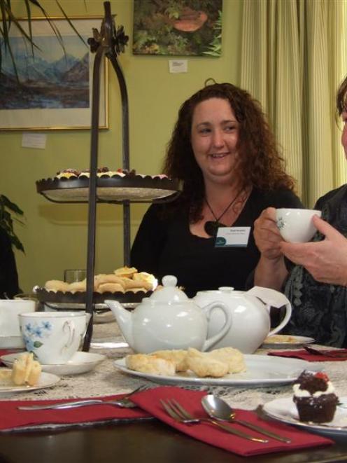 Enjoying the Wild Walnut Cafe's high tea in Lawrence yesterday are (from left) Elsie Thomson,  of...