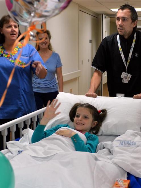 Enrolled nurse Karen Neilson (left), Blanca Vallduvi and orderly Bradley Hayward escort Isavena...