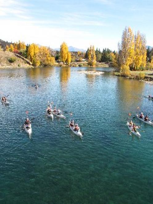 Entrants in the four-day Wild Descent kayak race on the Clutha River approach the starting line...