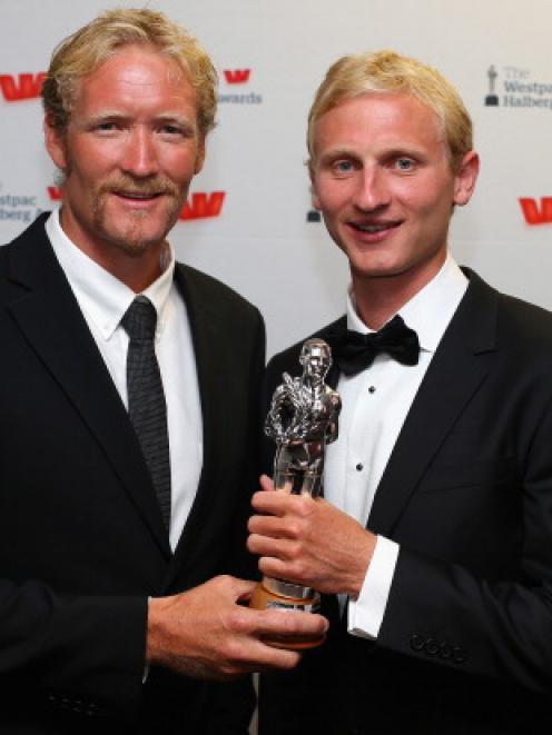 Eric Murray (L) and Hamish Bond pose with the Halberg Award for Team of the Year during the 2013...