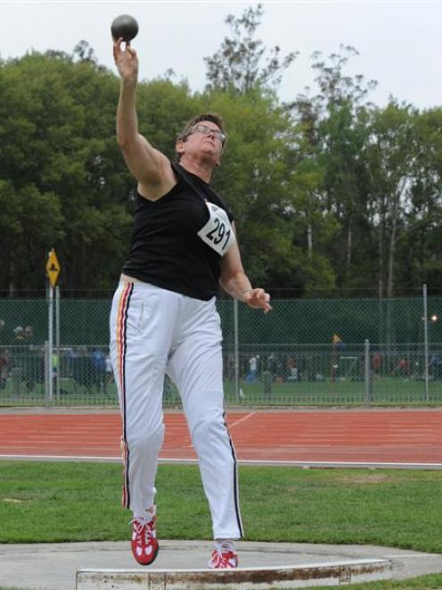 Erika Wolf on her way to a win in the women's aged 45-49 shot put. Photo by Jane Dawber.