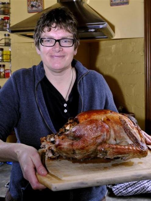 Erika Wolf with her traditional Thanksgiving roast turkey. Photo by Charmian Smith.