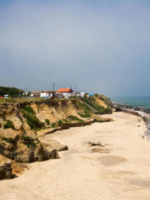 Eroded shoreline at Happisburgh in England, where scientists have found what they believe to be...