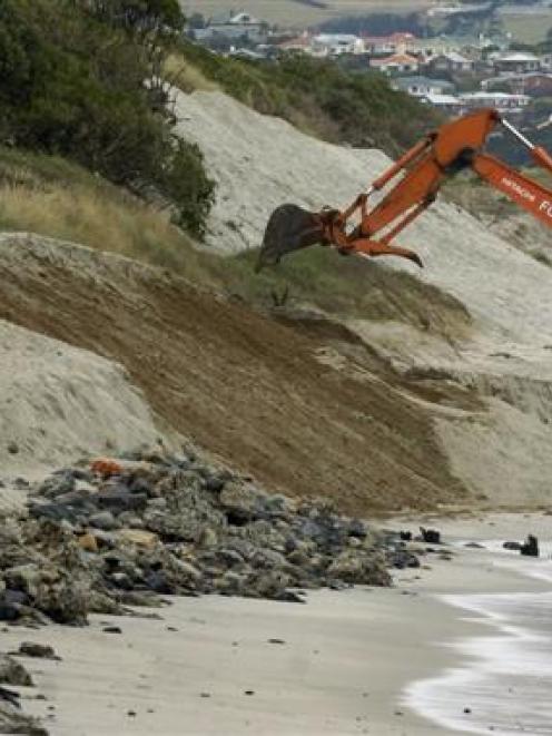 A digger repairs some of the damage on Dunedin’s St Clair beach near Moana Rua Rd after heavy...