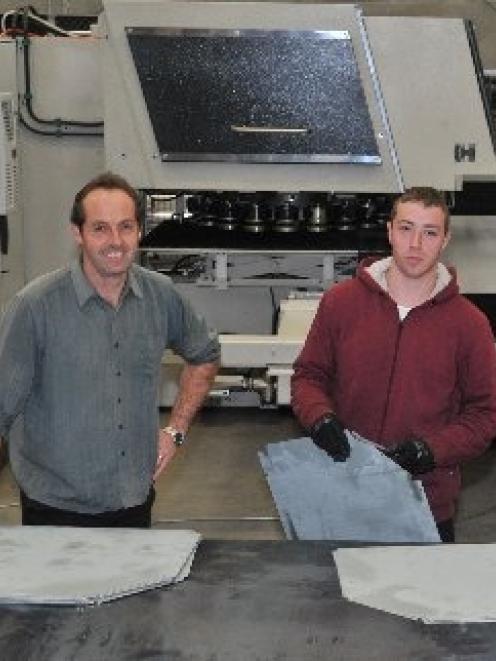 Escea operations manager Mark Davie (left) and CNC machine operator Ryan Savage with the new...