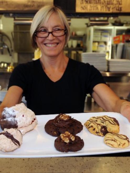 Espresso Garden Cafe manager Shona Miller holds a plate of the cafe's regular and bite-size...