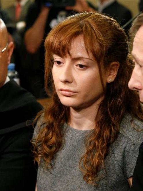 Estibaliz Carranza sits between her lawyers in court in Vienna. REUTERS/Leonhard Foeger