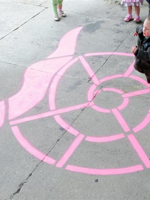 Ethan Schaaf (3), of Dunedin, plays on a snail marking painted at Arthur Street School in Dunedin...