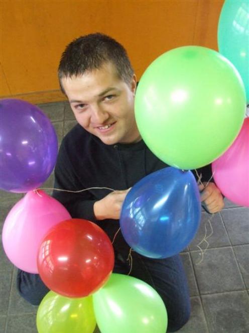 Eugen Dupu is hoping to establish a world record by having at least 10,000 inflated balloons in...