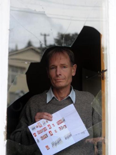 Euthanasia law reformer Sean Davison yesterday with a death threat he received in the post last...