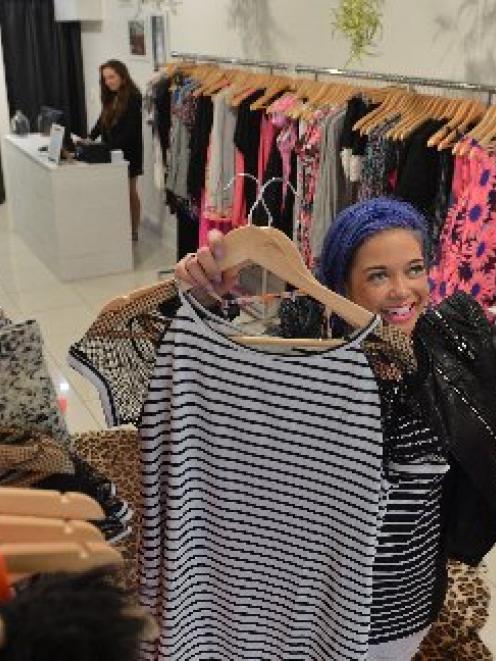 Evolution Clothing area manager Nikki Webster, of Mount Maunganui, prepares the company's new...