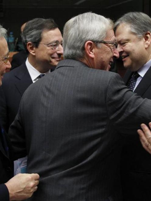 Exchanging ideas are (from left) Italian Finance Minister Giulio Tremonti, European Central Bank ...