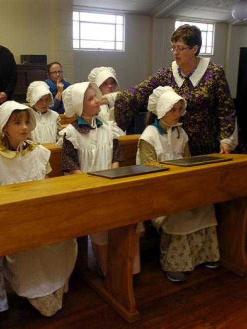 Experiencing education in a stricter 19th century style at the Otago Settlers Museum yesterday...