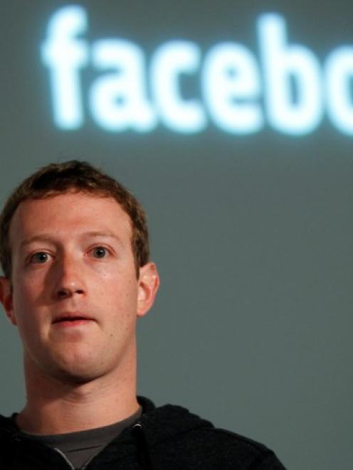 Facebook CEO Mark Zuckerberg listens to a question after introducing a new feature called 'Graph...