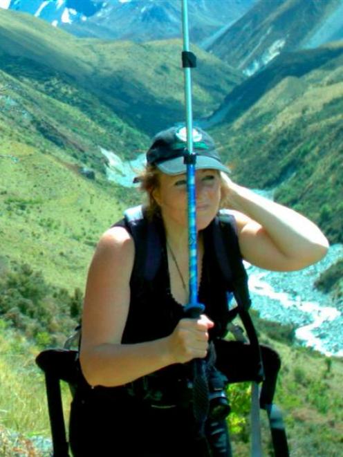 Falcon researcher Dr Donna Falconer (photographed by a motion-activated  camera) uses a walking...