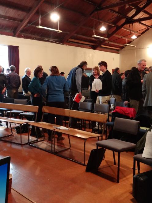 Farmers pause for a chat during a public meeting in Waikari last week. Photo by Amanda Bowes