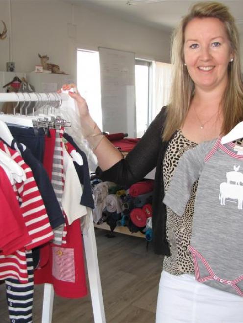 Fashion designer Christina Perriam with some of her Suprino Bambino range of merino clothing for...