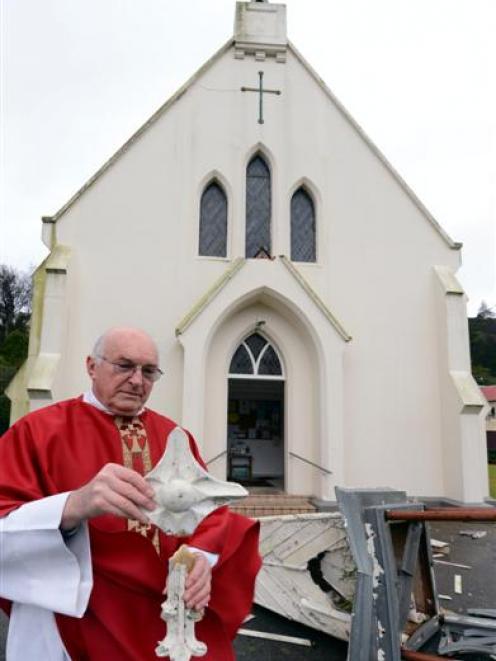 Father Aidan Cunningham, of Sacred Heart Church, in Northeast Valley, Dunedin, surveys the damage...