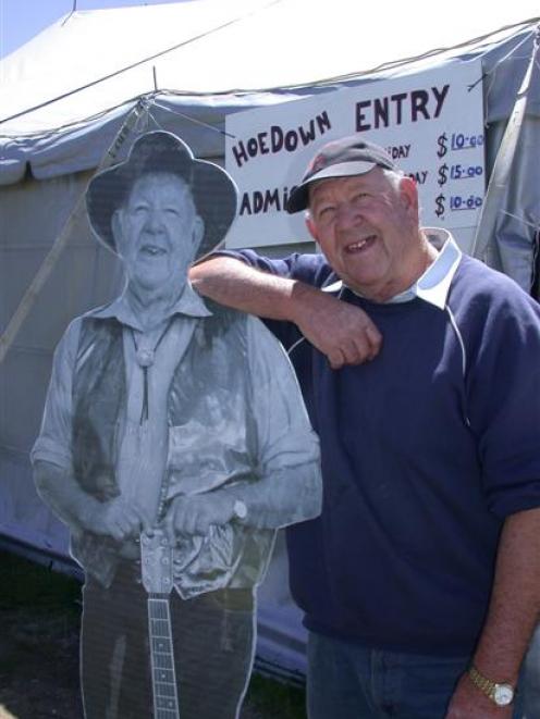 Ferg Mitchell (right and left) welcomes country music fans to the 25th anniversary of the Merino...
