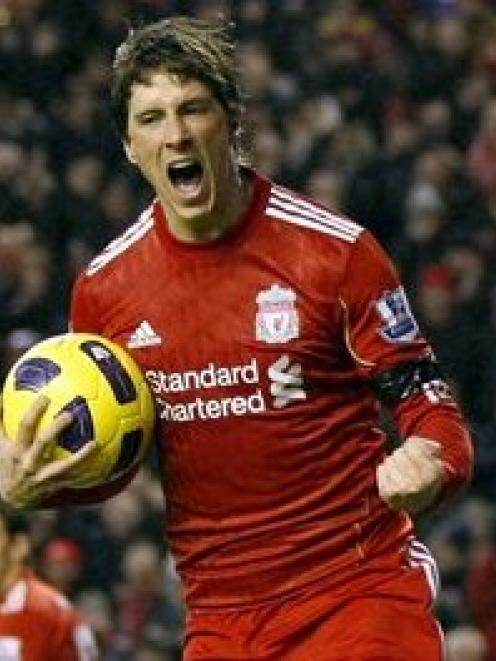 Fernando Torres celebrates scoring for Liverpool against Bolton Wanderers during their English...
