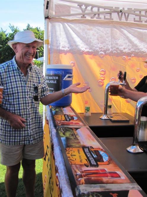 Festival patrons (from left) Colin Bunce and Bernie O’Meara, of Alexandra, sample the wares of ...