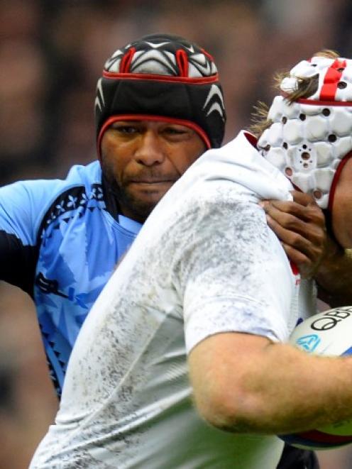 Fiji's Deacon Manu tackles England's Thomas Waldrom (R) during their rugby test at Twickenham...