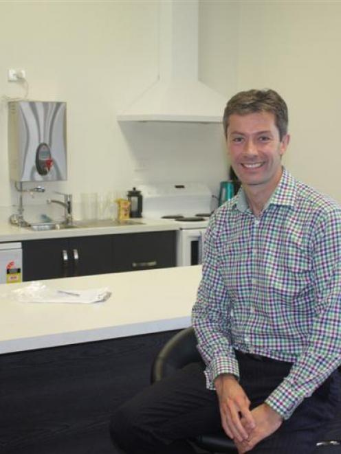 Finance Now co-owner Wayne Evans relaxes in the staffroom at the Invercargill head office. Photo...