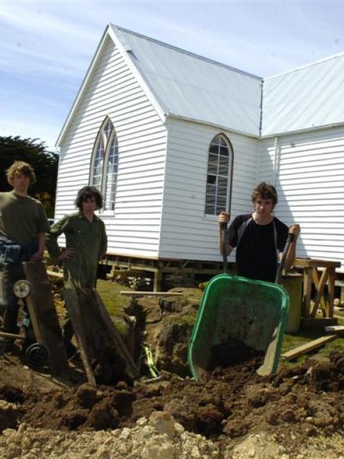 Finishing off excavations at Pukehiki Church on Otago Peninsula are (from left) 18-year-olds Fin...