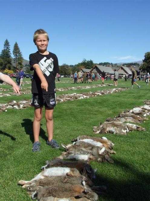 Finn Aitken (6, left) of Outram, and Jamie Hill (7), of Alexandra, inspecting some of the 10,424...