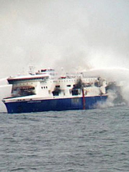 Fire-fighting tug boat crews battle the blaze on the car ferry Norman Atlantic. REUTERS/Skai TV