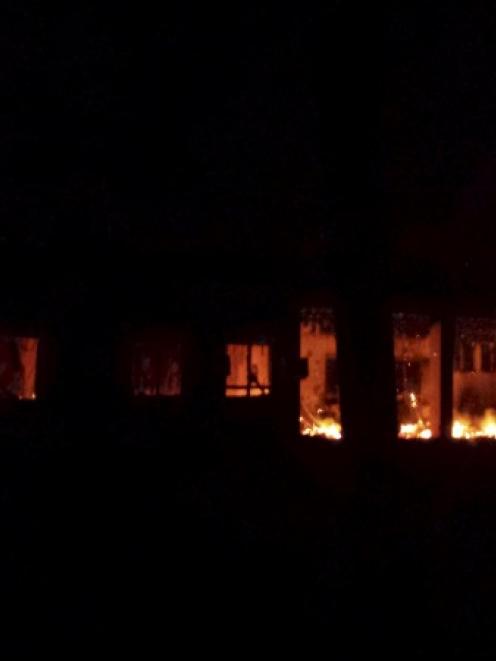 Fire is seen inside a Medecins Sans Frontieres (MSF) hospital building after an air strike in the...