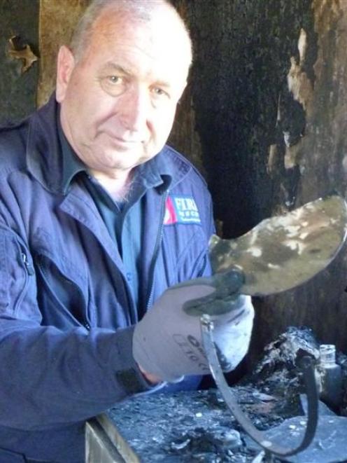 Fire risk management officer Stuart Ide with the mirror believed to have caused a house fire in...