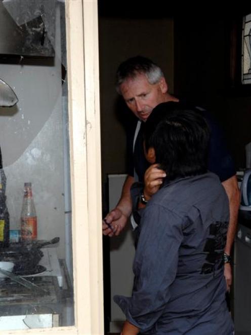 Fire Service Senior Station Officer Robert Torrance talks to tertiary student Anir Sharbirin...