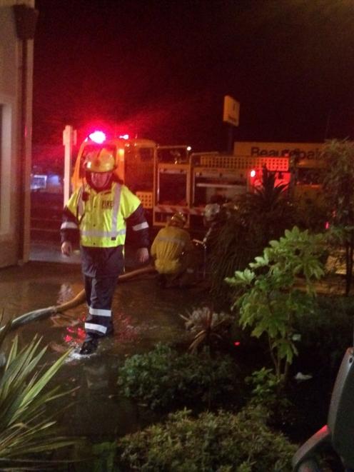 Firefighters attend a call at the Alexandra Pharmacy and Alexandra Medical Centre on Saturday...