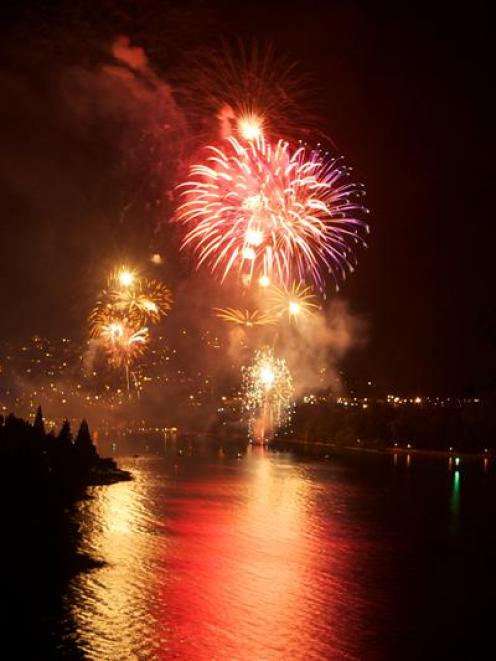 Fireworks light up the sky above central Queenstown as the arrival of 2012 is celebrated early...