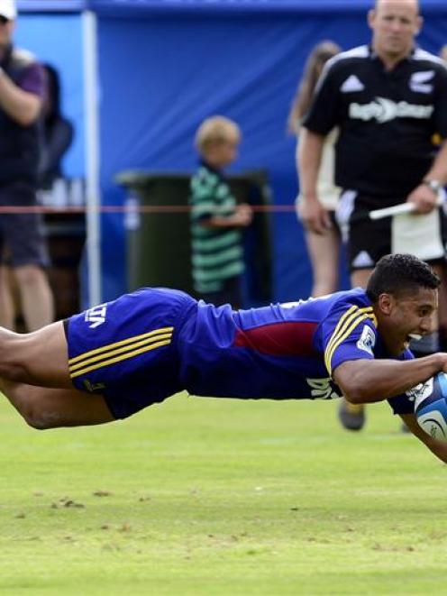 First five-eighth Lima Sopoaga dives over the line to score against the Crusaders. Photos by...