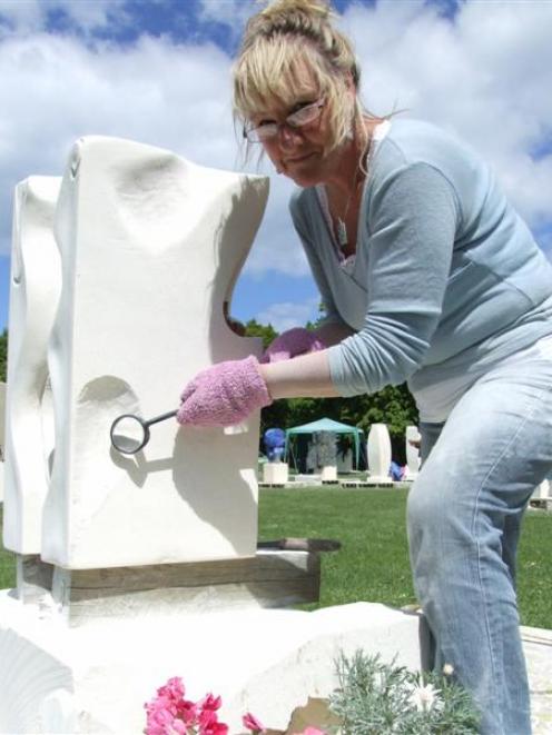 First-time stone symposium participant Dawn Ellis works on her sculpture at Takaro Park yesterday...