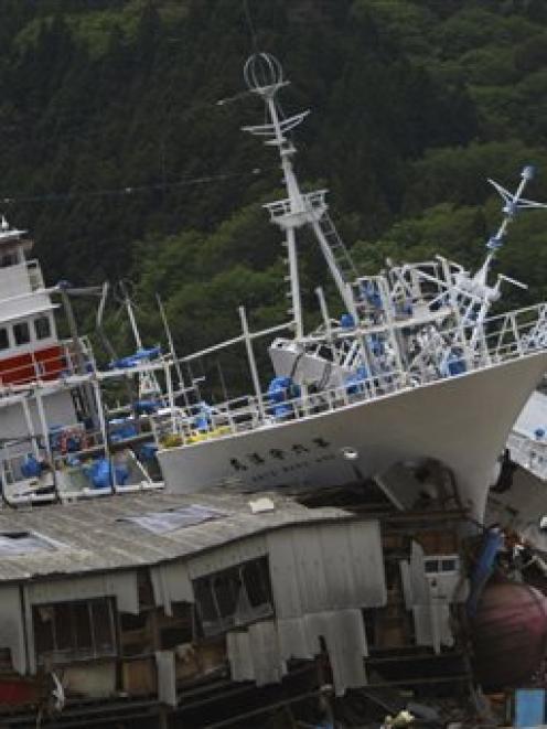 Fishing boats washed ashore by the March 11 earthquake are seen in Kesennuma, Miyagi Prefecture,...