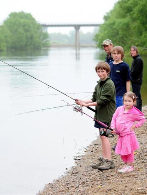 Fishing family (from front) Kate (4), Tim (11), Pete (13), Rob and Dawn Coates try their luck in...