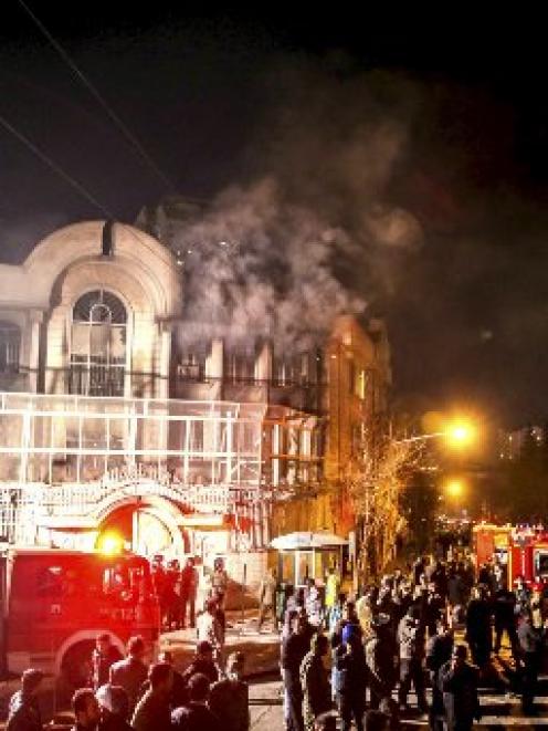 Flames rise from Saudi Arabia’s embassy during a demonstration in Teheran  this week after fury...