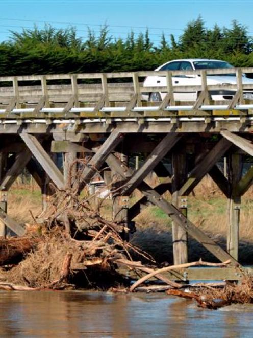 Flood debris is wedged under the bridge over the Kakanui River at Kakanui. Photo by Gerard O'Brien.