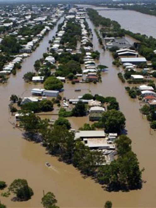 Floodwaters are seen in Depot Hill, Rockhampton, Australia.  (AP Photo/Janie Barrett, Pool)