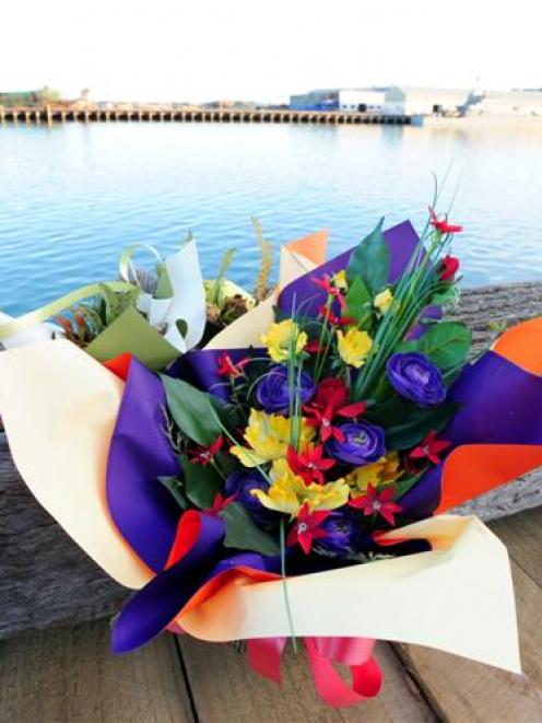 Flowers placed as a memorial to Regan McCormack, who drowned in Otago Harbour last year. Photo by...